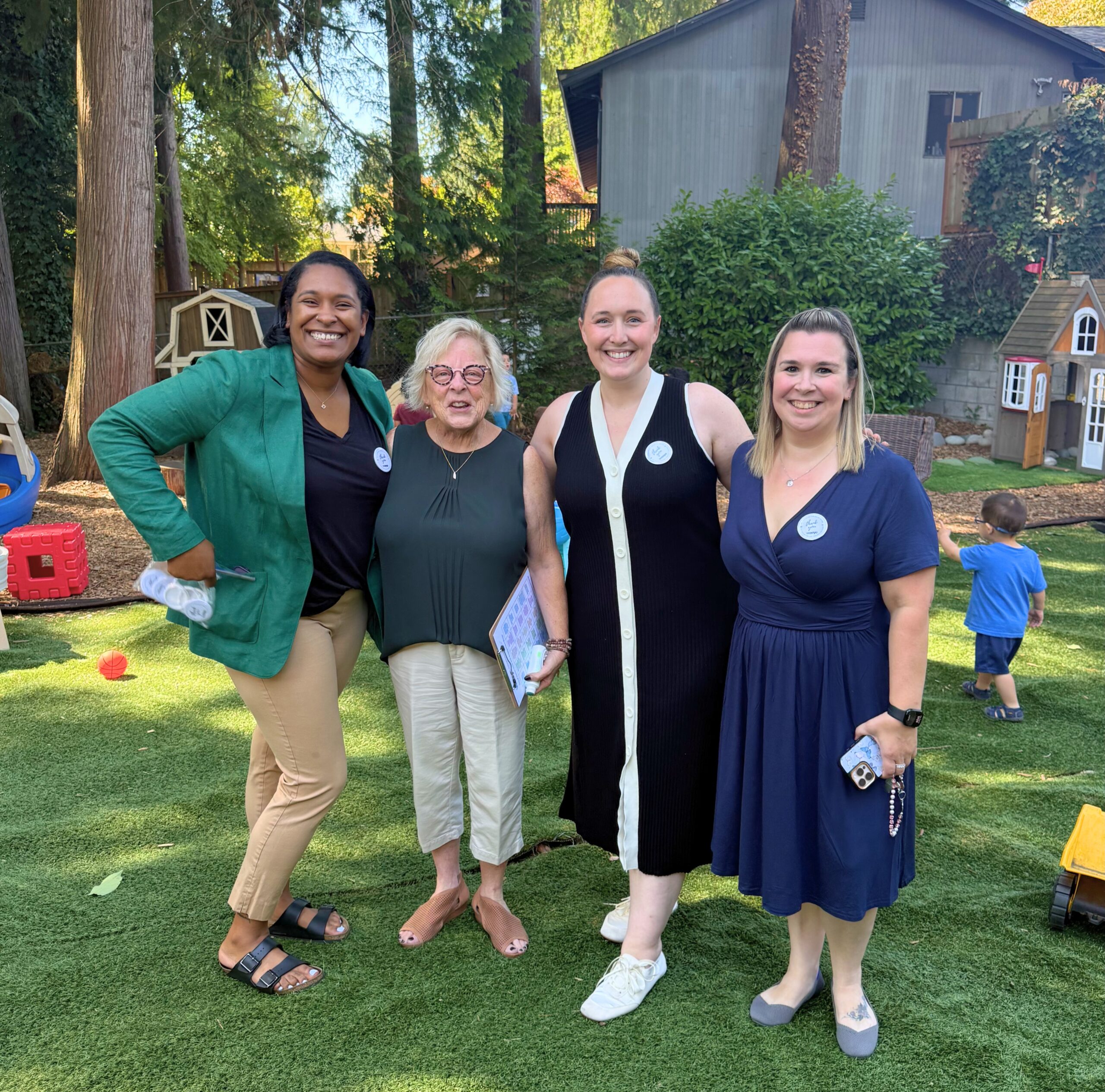 Pathwaves Fellow Raishawn Swensen and Senator Claire Wilson join owners Maggie and Abra of Global Early Learning on the playground