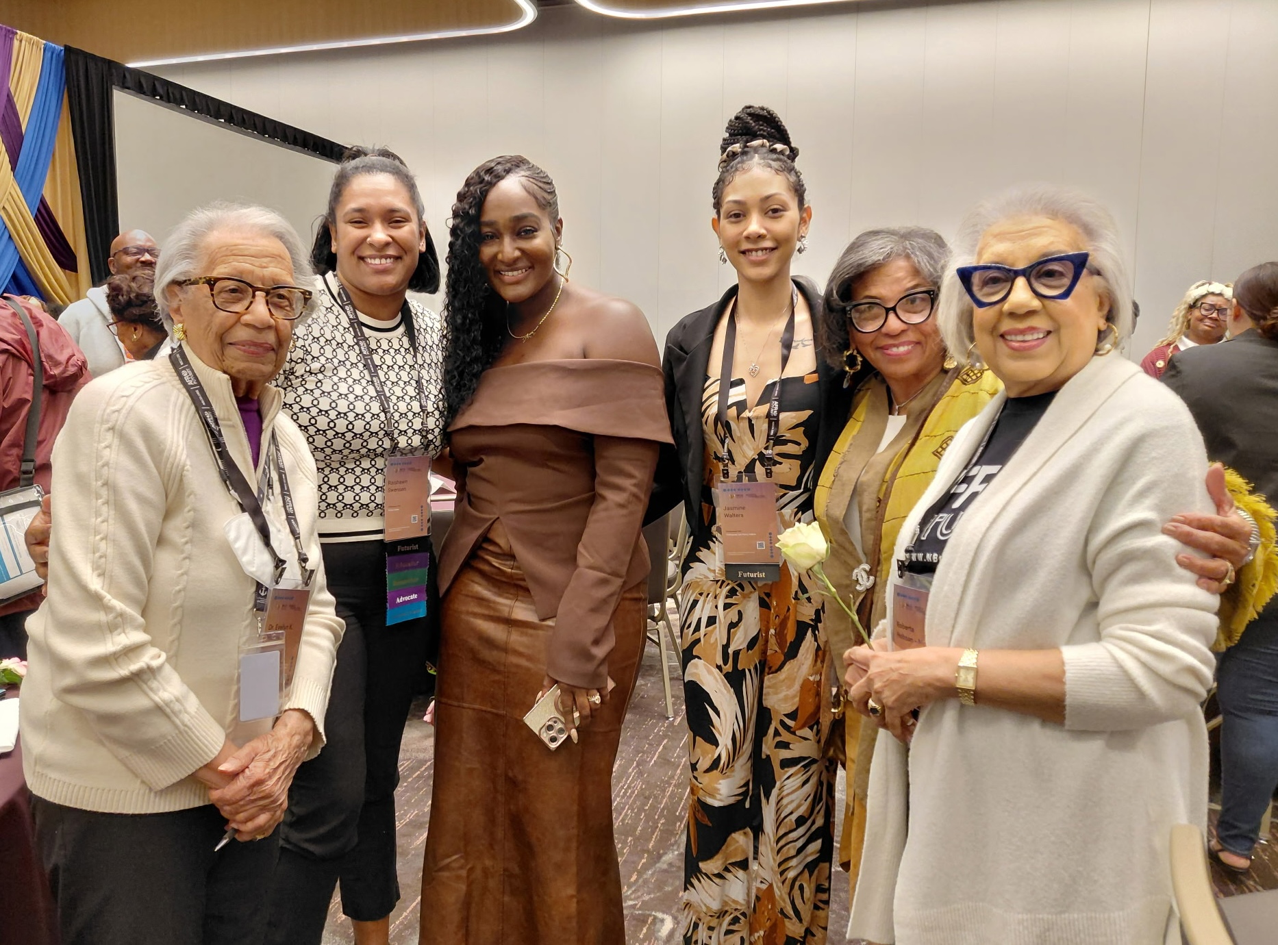 Six Black women stand together smiling at the National Black Child Development Institute Conference in Atlanta